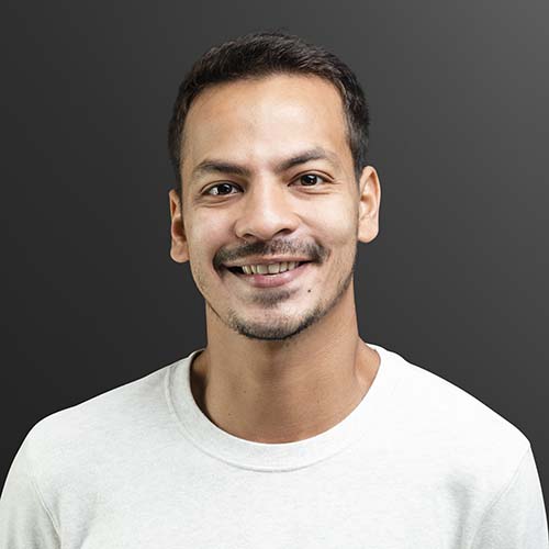 smiling man in white long sleeve tee portrait ynpwerg.jpg